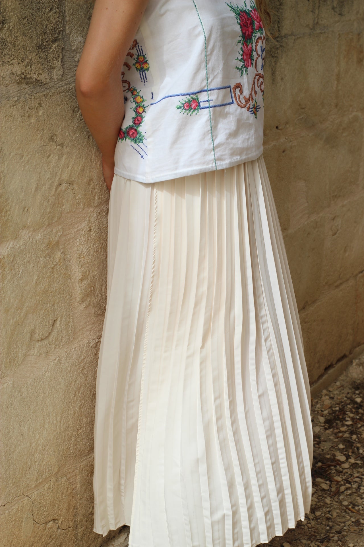Long white pleated skirt