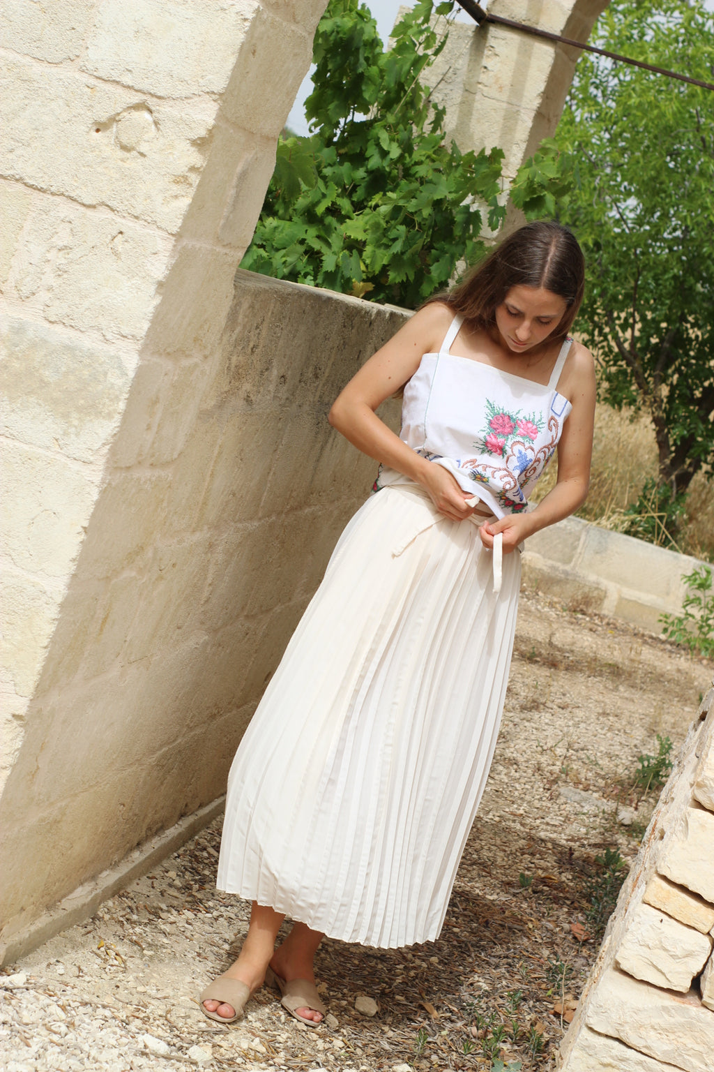 Long white pleated skirt